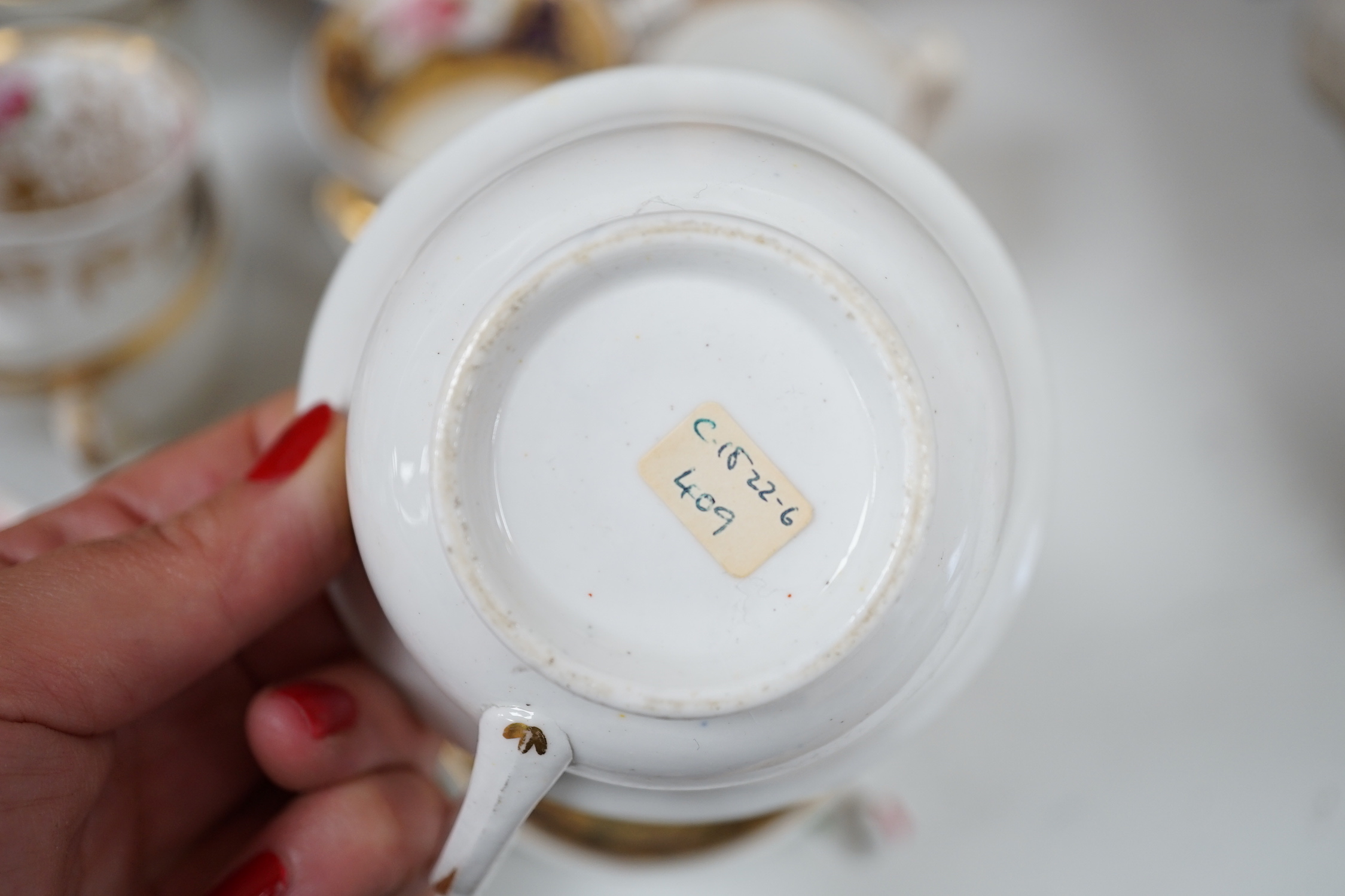 A group of Regency and Victorian porcelain tea, coffee cups and saucers, Newhall, Chamberlains, Coalport, etc.